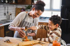 Woman cooking with child